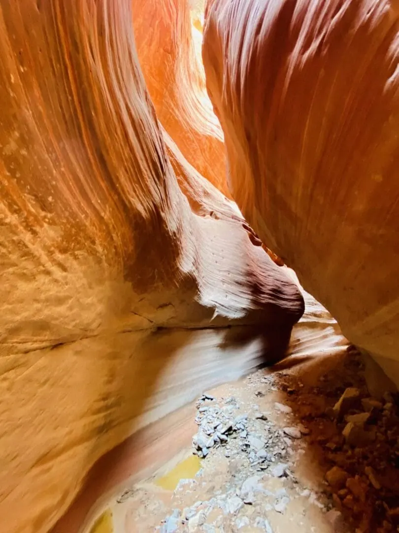 Curving orange sandstone walls inside Peekaboo Slot Canyon