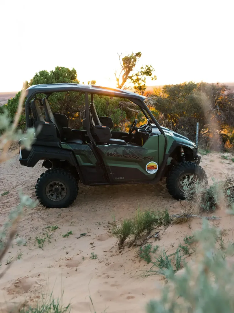 An Expedition Kanab UTV parked on sandy desert terrain near Kanab