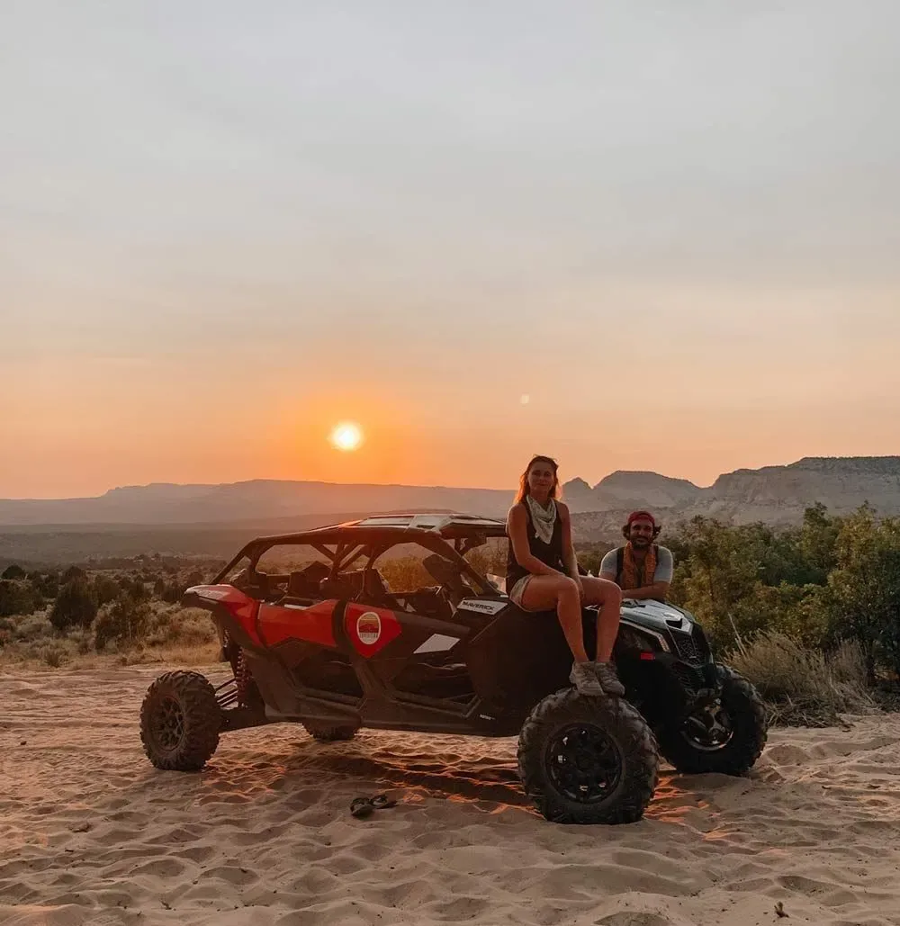 Two travelers on a UTV in the Kanab backcountry at sunset